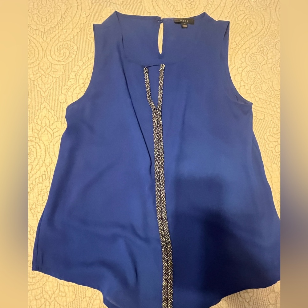 Blue top with embroidered beading through the front. Small
